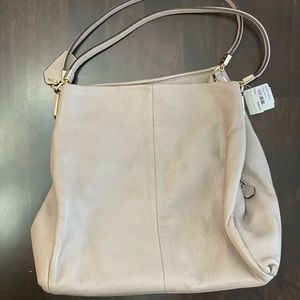 Coach cream colored purse with lavender interior. Never used…!